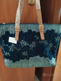 borsa nuova con applicato un ricamo in cotone