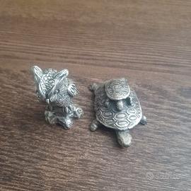 Coppia di statuette in peltro argentato 999