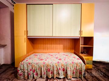 Camera a ponte ante scorrevoli