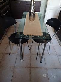 Tavolo in cristallo e sedie Enzo Mari per Zanotta