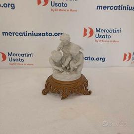 Figurina in bisquit su base in ottone