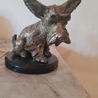 statua in metallo di cane di V. Bertolotti