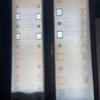 Coppia di tende beige con motivo semi trasparente