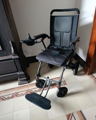 sedia a rotelle elettrica e altri ausili