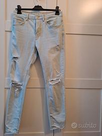 Pantaloni jeans skinny strappati 