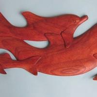 Delfini in legno