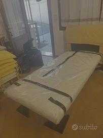 letto singolo con testata imbottita