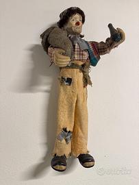 Antica bambola clown ubriacone in porcellana