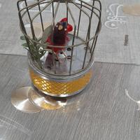cabbia di uccellino meccanico che cante a  pile 