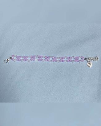 BRACCIALE CON PERLINE LILLA E TRASPARENTI