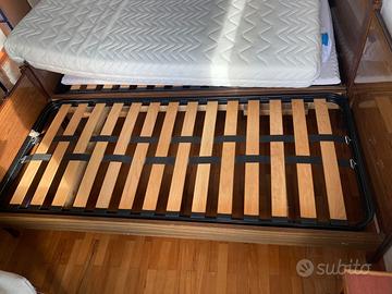 Doghe in legno con letto matrimoniale