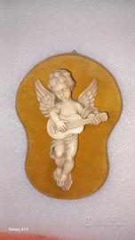 putto con chitarra