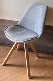 poltroncina in tessuto grigio imbottita girevole