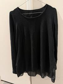 Maglia da donna di colore nero a maniche lunghe.