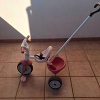 Triciclo Smoby rosa con canna parentale