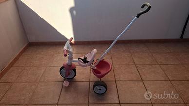 Triciclo Smoby rosa con canna parentale