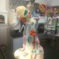 Statuina giapponese in ceramica