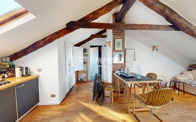 BILOCALE MANSARDATO CON BALCONE