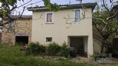 Casa e terreno edificabile