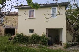 Casa e terreno edificabile