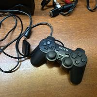 playstation 2 con 2 controller e un cavo ethernet