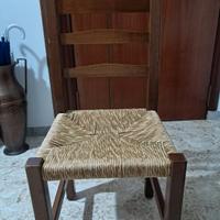 Quattro sedie in legno noce