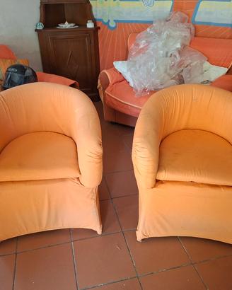 Coppia di poltrone a pozzetto arancioni 