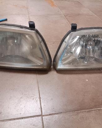 fanali fari l200 k74t con motorino MR339733 / 734