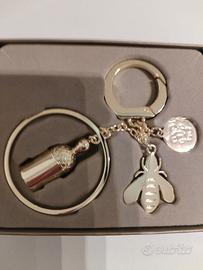 PORTACHIAVE GUERLAIN IN METALLO DORATO CON CIONDOL