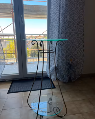 Tavolino rotondo in ferro e vetro