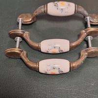 Maniglie per cassetti in ceramica e ottone