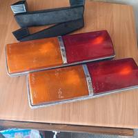 Fanali e braccioli Fiat 124 1 serie