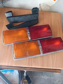 Fanali e braccioli Fiat 124 1 serie