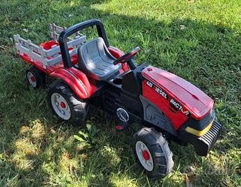 Trattore a pedali Peg Perego rosso con rimorchio