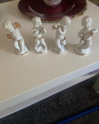 Set 4 statuine putti musicanti porcellana bianca