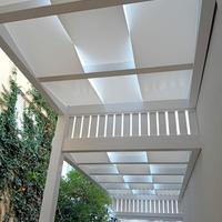 Pergola in legno con teli ad onda in PVC