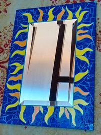 Mosaico con specchio