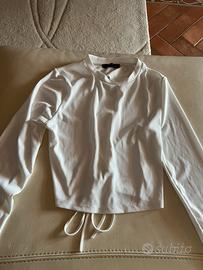 Magliettina maniche lunghe mezza aperta dietro