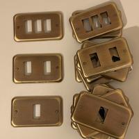 Placche copri presa in ottone (27 pz)