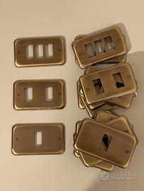 Placche copri presa in ottone (27 pz)