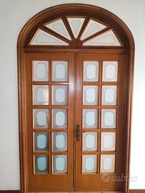 Porta interna doppia in legno massello con arco 