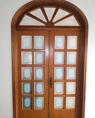Porta interna doppia in legno massello con arco 