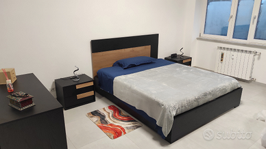 Posto letto in camera matrimoniale arredata