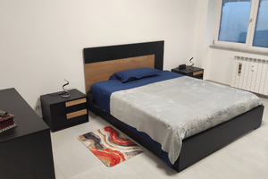 Posto letto in camera matrimoniale arredata