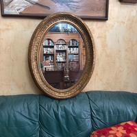 Specchio con cornice il legno dorata