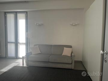 Divano  letto matrimoniale grigio madreperla