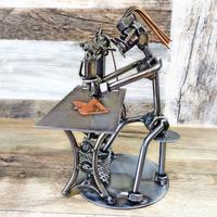 Scultura viti e bulloni SARTA stilista costumista