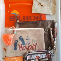 Set di borsellini toni aranciati, beige, rame