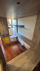 LETTO RIALZATO CON ARMADIO