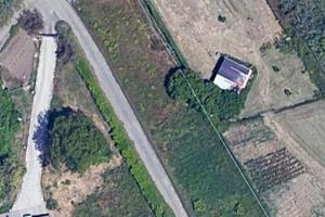 Terreno con tettoia in travi lamellari